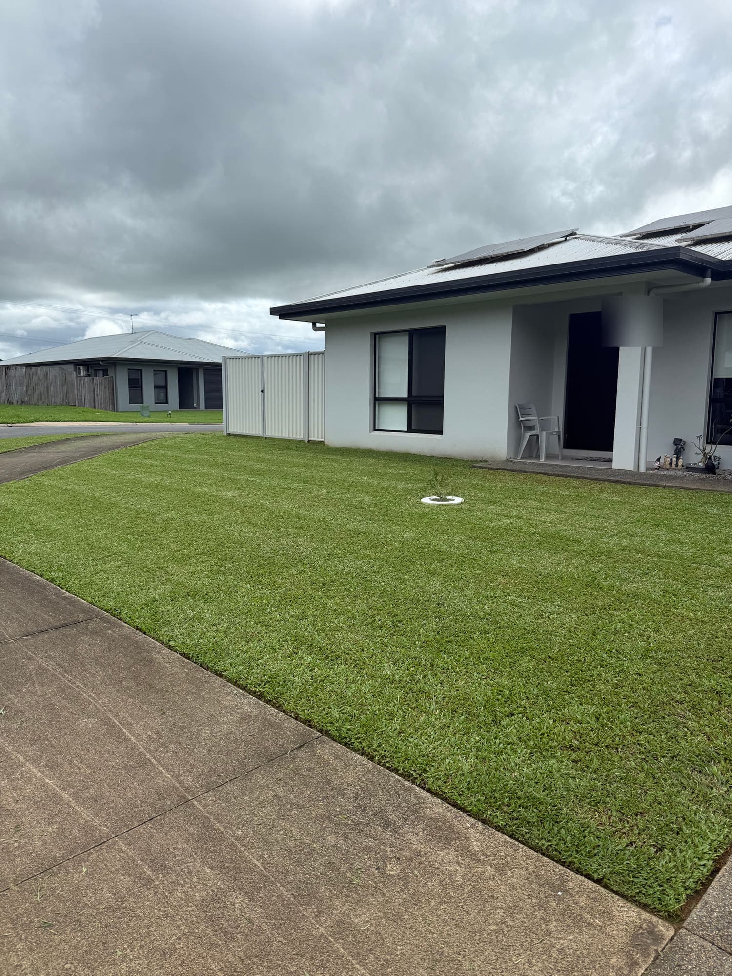Mown lawn and tidy edges at a modern Cairns home