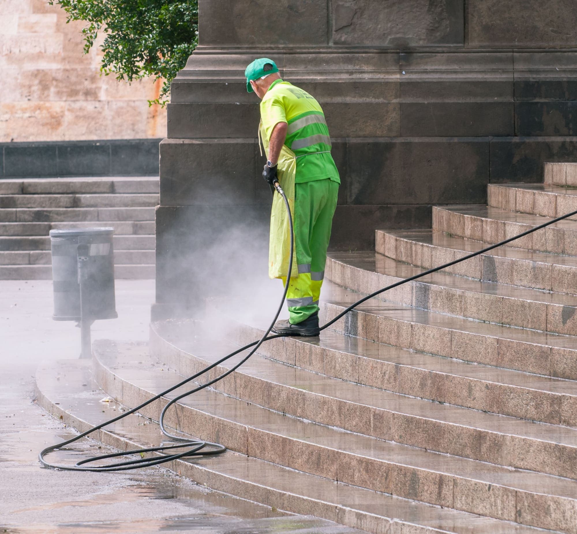 Outdoor steps being cleaned with a high pressure washer